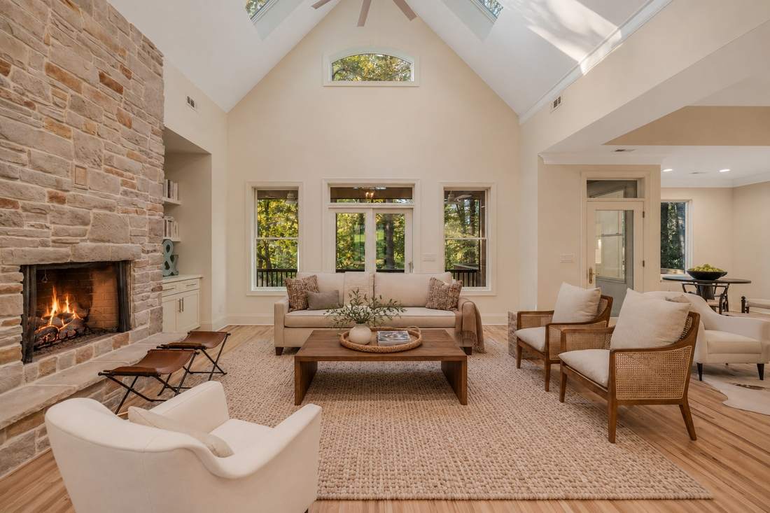 Great room with stacked stone fireplace