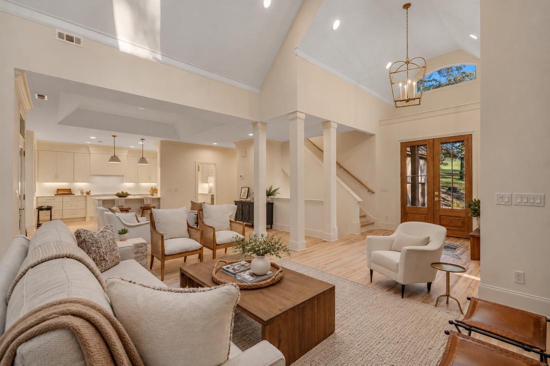 Great room toward the kitchen (virtually staged)